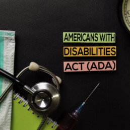 Americans with Disabilites Atc (ADA) text on top view black table with blood sample and Healthcare/medical concept.